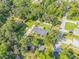 Aerial view of home with lush landscaping and serene location at 1144 Corbin Park Rd, New Smyrna Beach, FL 32168