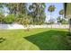 The spacious backyard is fully fenced and features a lush, green lawn at 1144 Corbin Park Rd, New Smyrna Beach, FL 32168