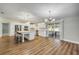 Open kitchen with a large island, stainless appliances, and view to the screened in porch at 1144 Corbin Park Rd, New Smyrna Beach, FL 32168
