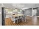 Modern kitchen with granite countertops, stainless steel appliances, and bar seating at 1144 Corbin Park Rd, New Smyrna Beach, FL 32168