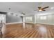 Spacious open concept living room featuring wood flooring and ample natural light at 1144 Corbin Park Rd, New Smyrna Beach, FL 32168