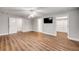 Spacious main bedroom with a ceiling fan, laminate flooring, and ensuite bathroom access at 1144 Corbin Park Rd, New Smyrna Beach, FL 32168