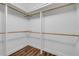 This is a large walk-in closet with lots of storage space, and laminate wood flooring at 1144 Corbin Park Rd, New Smyrna Beach, FL 32168