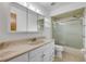 Bathroom with a shower/tub combo with sliding glass doors and a vanity with a large mirror at 125 Orange Ave, Edgewater, FL 32132