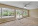 Bright sunroom with large windows and sliding door, perfect for relaxation and enjoyment at 125 Orange Ave, Edgewater, FL 32132