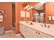 The bathroom features a double sink vanity, a large mirror, and an enclosed tiled shower at 1442 Carlow Cir, Ormond Beach, FL 32174