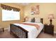 Cozy bedroom with natural light, a large window, and floral accents creating a relaxing atmosphere at 1442 Carlow Cir, Ormond Beach, FL 32174
