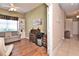 Bonus room features hardwood floors, neutral walls, and a cozy sofa with a desk and shelving at 1442 Carlow Cir, Ormond Beach, FL 32174