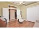 A versatile bonus room with a vaulted ceiling, white chair, and convenient access to the kitchen at 1442 Carlow Cir, Ormond Beach, FL 32174