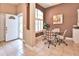 Cozy breakfast nook with a round table, chairs, and lots of natural light through windows at 1442 Carlow Cir, Ormond Beach, FL 32174