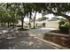 Wide view of a home with a well-maintained lawn, and three-car garage at 1442 Carlow Cir, Ormond Beach, FL 32174