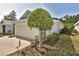 Garage exterior with partial home view and landscaping at 1442 Carlow Cir, Ormond Beach, FL 32174