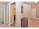 Bright hallway with tile flooring, and access to a powder room and bedrooms at 1442 Carlow Cir, Ormond Beach, FL 32174