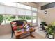 Sunroom featuring cozy seating, large windows, and a fan for comfort at 1442 Carlow Cir, Ormond Beach, FL 32174