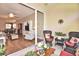 View through sliding glass doors into a living room with wood floors and lanai access at 1442 Carlow Cir, Ormond Beach, FL 32174