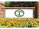 Entrance sign to Halifax Plantation Golf Club with flower bed and brick columns at 1442 Carlow Cir, Ormond Beach, FL 32174