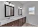 Modern bathroom featuring double sinks, quartz countertops, and dark wood cabinetry at 15190 Cr-565A, Clermont, FL 34711