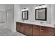 Stylish bathroom boasts double sinks, quartz countertops, dark wood cabinets, and a large closet at 15190 Cr-565A, Clermont, FL 34711