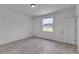 Bright bedroom with modern flooring, and a window with natural light at 15190 Cr-565A, Clermont, FL 34711