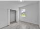 Bright bedroom features modern flooring, closet and a sunlit window offering lovely outdoor views at 15190 Cr-565A, Clermont, FL 34711