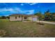Well-maintained single-story home featuring a spacious lawn and an attached two-car garage at 15190 Cr-565A, Clermont, FL 34711