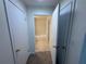 Bathroom view with tile flooring, tub-shower, and a doorway leading to a closet space at 1600 Big Tree Rd # L1, South Daytona, FL 32119