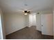 This bedroom has a ceiling fan and laminate flooring at 1600 Big Tree Rd # L1, South Daytona, FL 32119