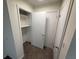 A small, organized closet with shelving and fresh paint at 1600 Big Tree Rd # L1, South Daytona, FL 32119