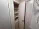 Open storage closet with shelving and storage in neutral colors at 1600 Big Tree Rd # L1, South Daytona, FL 32119