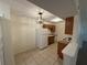 Functional kitchen with white appliances and wooden cabinets at 1600 Big Tree Rd # L1, South Daytona, FL 32119