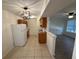 Open kitchen layout with breakfast bar and view into living area at 1600 Big Tree Rd # L1, South Daytona, FL 32119