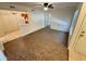 Open-concept living room with views into the kitchen, featuring wood-look flooring at 1600 Big Tree Rd # L1, South Daytona, FL 32119