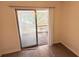 View of a living room leading to a screened porch through sliding glass doors at 1600 Big Tree Rd # L1, South Daytona, FL 32119