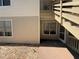 A patio with exterior stairs to an upper unit provides outdoor space and private access at 1600 Big Tree Rd # L1, South Daytona, FL 32119