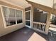 A cozy screened patio with a window is perfect for relaxing outdoors with stairs on the right side at 1600 Big Tree Rd # L1, South Daytona, FL 32119