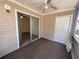 Outdoor porch view with sliding glass doors leading into the home at 1600 Big Tree Rd # L1, South Daytona, FL 32119