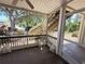 View of the outside from a screened in porch, showing landscaping and stairs at 1600 Big Tree Rd # L1, South Daytona, FL 32119