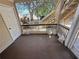 Exterior view of a screened in porch with overhead coverage and views at 1600 Big Tree Rd # L1, South Daytona, FL 32119