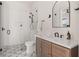 Bright bathroom featuring a glass shower, modern fixtures, and stylish geometric tile flooring at 1624 Turnbull Crossings Dr, New Smyrna Beach, FL 32168