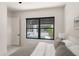Relaxing bedroom features a plush bed and a view of the outdoor pool area at 1624 Turnbull Crossings Dr, New Smyrna Beach, FL 32168