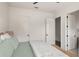 Bright bedroom features views of ensuite and closet at 1624 Turnbull Crossings Dr, New Smyrna Beach, FL 32168