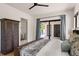 Cozy bedroom with an ensuite bathroom and private patio access at 1624 Turnbull Crossings Dr, New Smyrna Beach, FL 32168