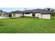 Beautifully maintained home with a lush green lawn and meticulously landscaped yard at 1624 Turnbull Crossings Dr, New Smyrna Beach, FL 32168