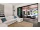 Comfortable living room featuring seamless access to an outdoor living area with pool at 1624 Turnbull Crossings Dr, New Smyrna Beach, FL 32168