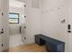 Hallway and mud room featuring seating, hanging, and storage solutions at 1624 Turnbull Crossings Dr, New Smyrna Beach, FL 32168