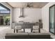 Entertain with ease in this outdoor kitchen and seating area near the screened in pool at 1624 Turnbull Crossings Dr, New Smyrna Beach, FL 32168