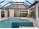 Luxury outdoor living with a pool, spa, kitchen, dining, and lounge areas at 1624 Turnbull Crossings Dr, New Smyrna Beach, FL 32168