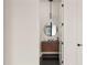 Tastefully designed powder room with modern vanity, decorative mirror, and elegant lighting at 1624 Turnbull Crossings Dr, New Smyrna Beach, FL 32168