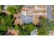 Overhead shot of property showing roof and large lot with mature trees and shed at 1718 Maryland Ave, Ormond Beach, FL 32174