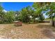 Large backyard area features mature trees, a storage shed and plenty of space for many uses at 1718 Maryland Ave, Ormond Beach, FL 32174